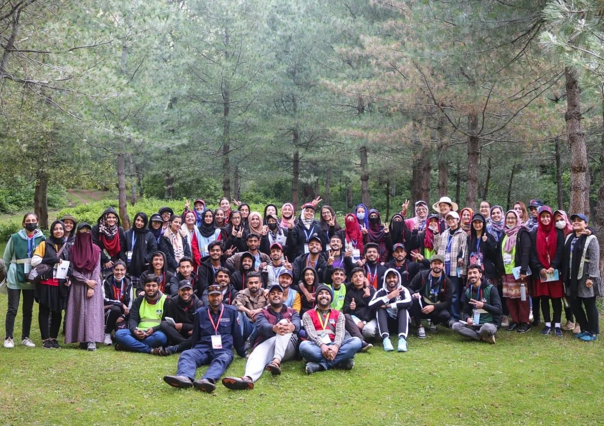 The whole Camp Himalayas group, Lalain among them, posing among pine trees