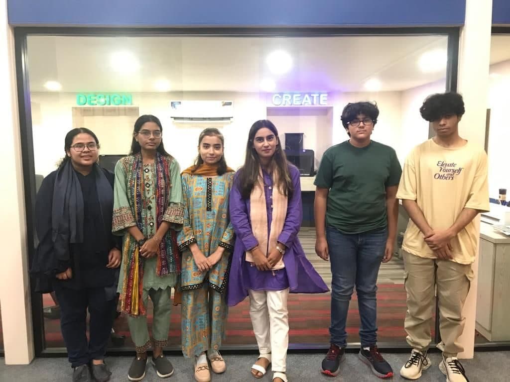 Lalain standing with a small group of teenagers